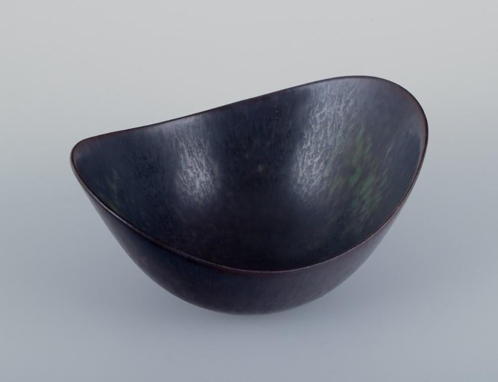Scandinavian Modern Gunnar Nylund for Rörstrand. Ceramic bowl with glaze in blue and brown tones. For Sale