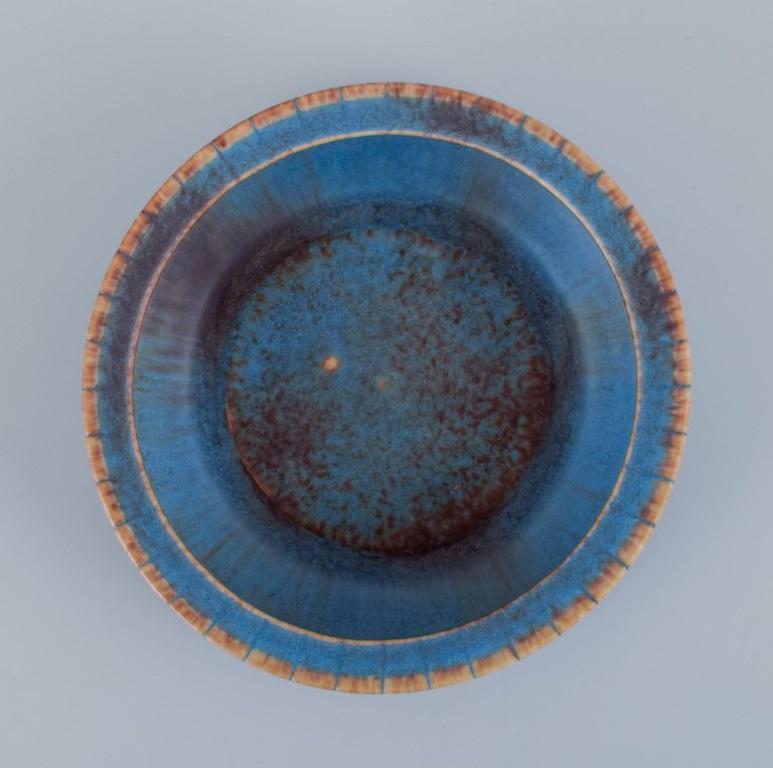 Swedish Gunnar Nylund for Rörstrand. Ceramic bowl with glaze in blue and brown tones. For Sale