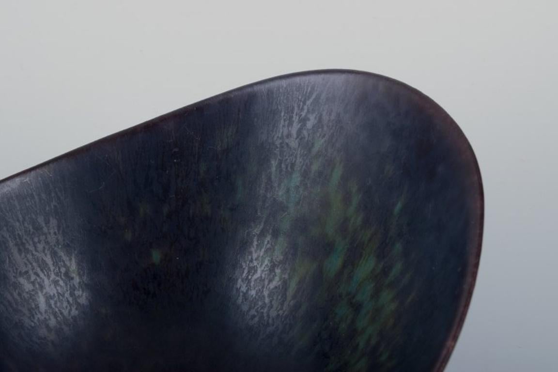 Swedish Gunnar Nylund for Rörstrand. Ceramic bowl with glaze in blue and brown tones. For Sale