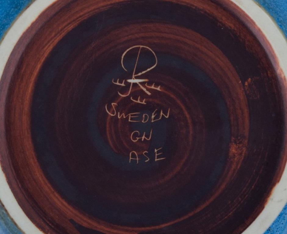 20th Century Gunnar Nylund for Rörstrand. Ceramic bowl with glaze in blue and brown tones. For Sale