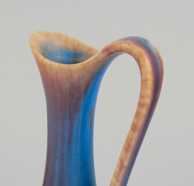 Swedish Gunnar Nylund for Rörstrand. Ceramic pitcher with blue and brown  glaze For Sale