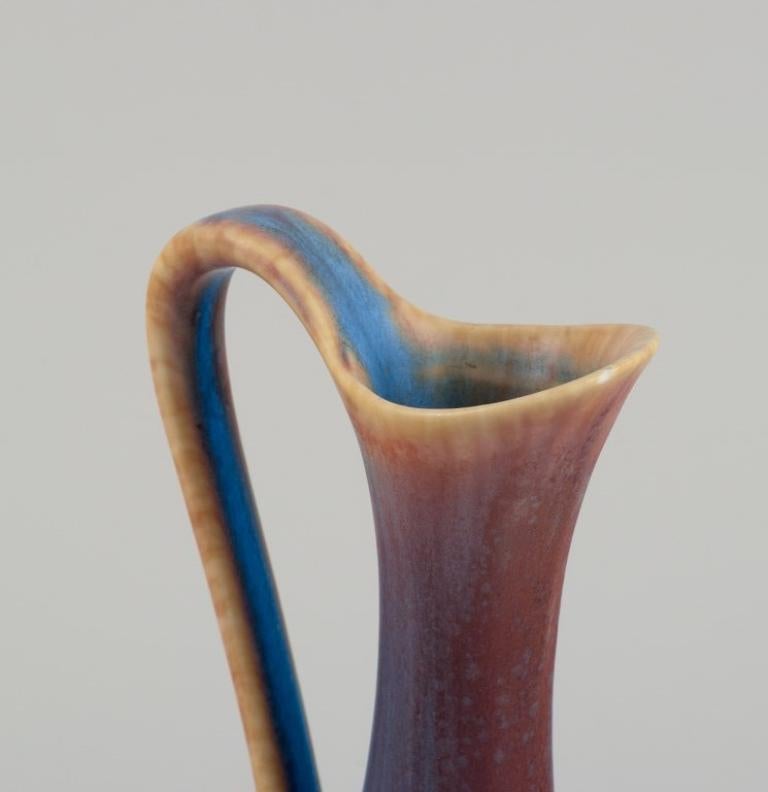 20th Century Gunnar Nylund for Rörstrand. Ceramic pitcher with blue and brown  glaze