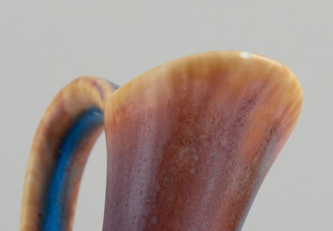 Gunnar Nylund for Rörstrand. Ceramic pitcher with blue and brown  glaze 1
