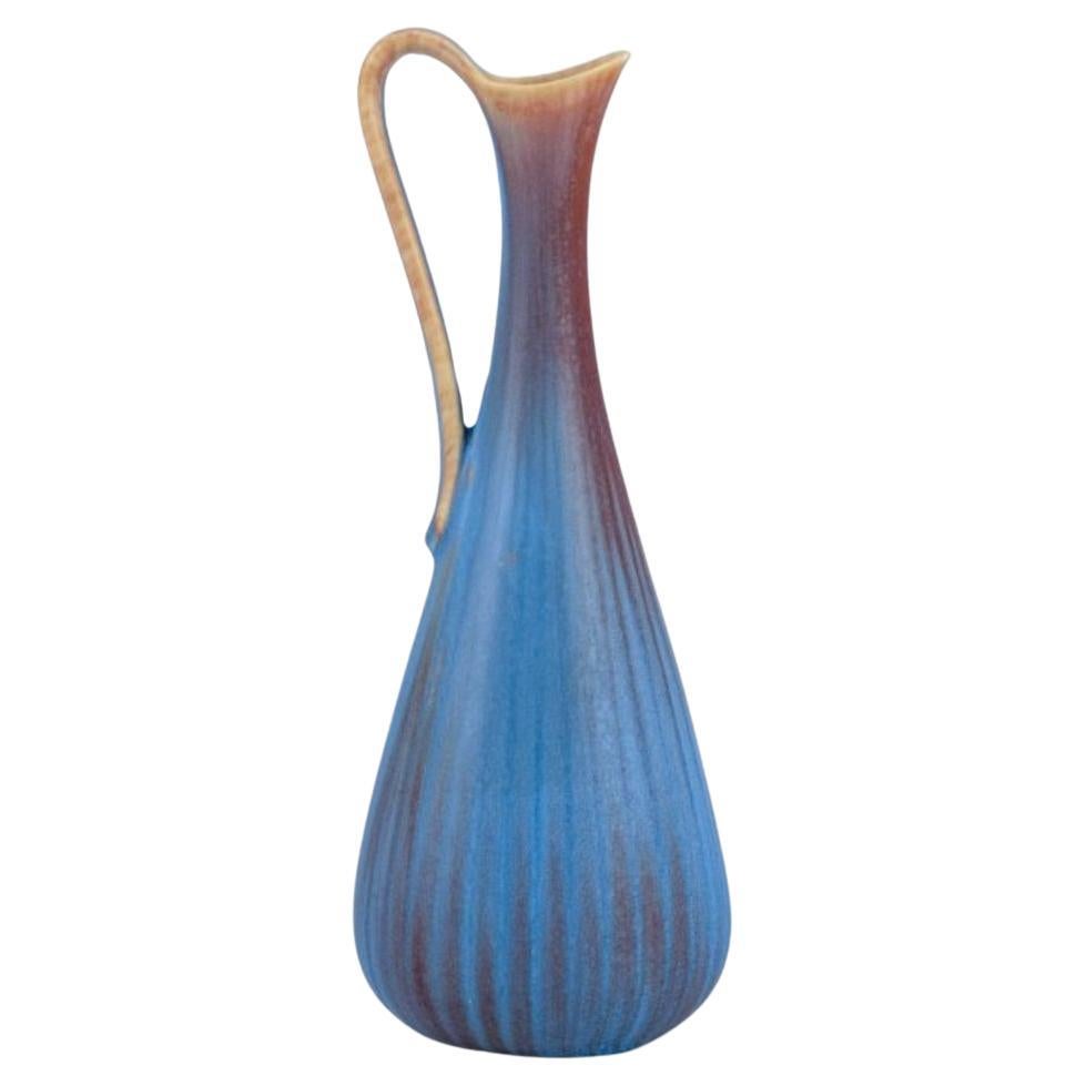 Gunnar Nylund for Rörstrand. Ceramic pitcher with blue and brown  glaze For Sale