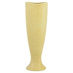 Gunnar Nylund for Rörstrand. Ceramic vase in chamotte clay. Yellow glaze
