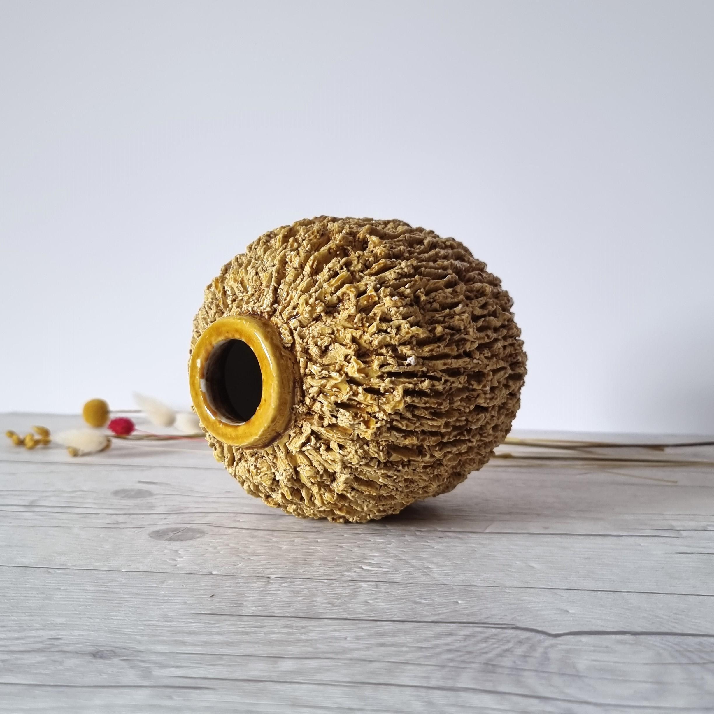 This viviacious work of Swedish Modernist design is the 'Igelkott' ('Hedgehog') vase that comes from the larger 'Chamott' (Chamotte) series designed between 1936 to 1948. The series was designed by the celebrated Swedish ceramicist and designer