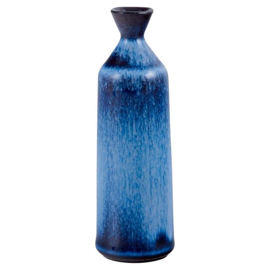 Gunnar Nylund for Rörstrand. Miniature ceramic vase with blue glaze. For Sale