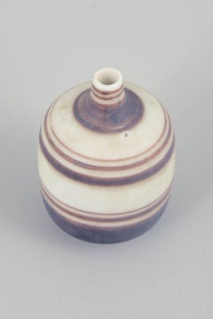 Gunnar Nylund for Rörstrand. Miniature stoneware vase with striped decoration.