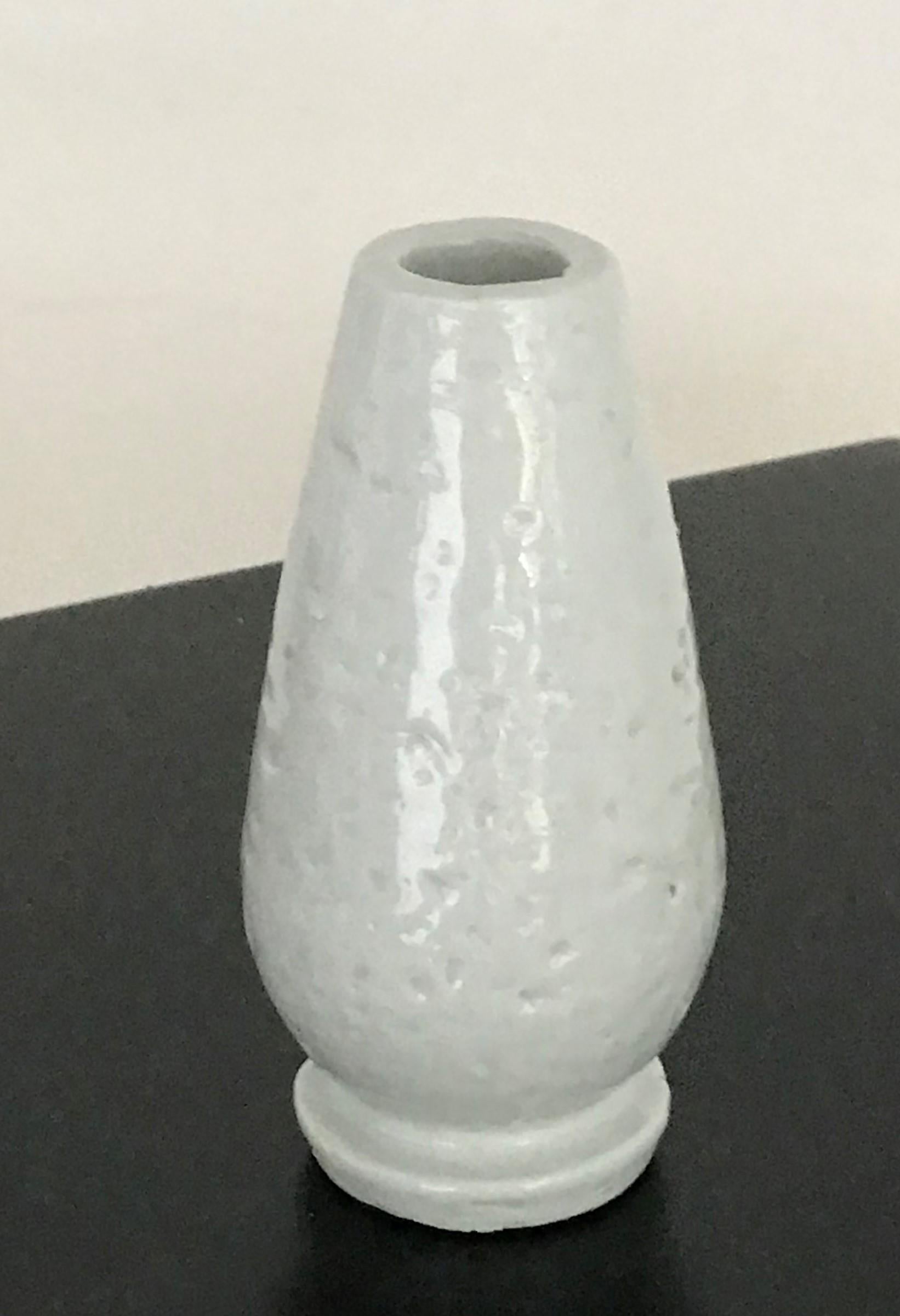 REDUCED FROM $280....Exquisite creation by Gunnar Nylund (1914–1997) during his tenure as artistic director of Rörstrand from 1932 through the 1950s. The vase has a glossy white glaze over a rough rustic body creating a smooth touch but a brutal