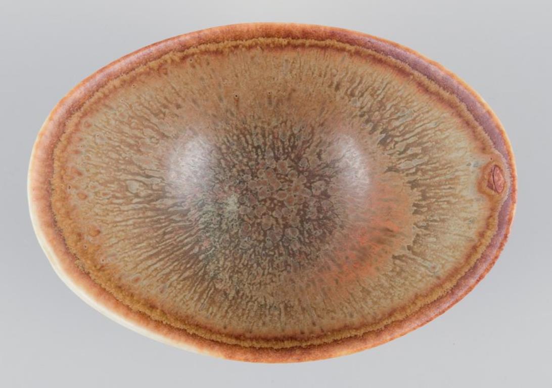 Glazed Gunnar Nylund for Rörstrand. Small ceramic bowl. Glaze in earthy tones For Sale