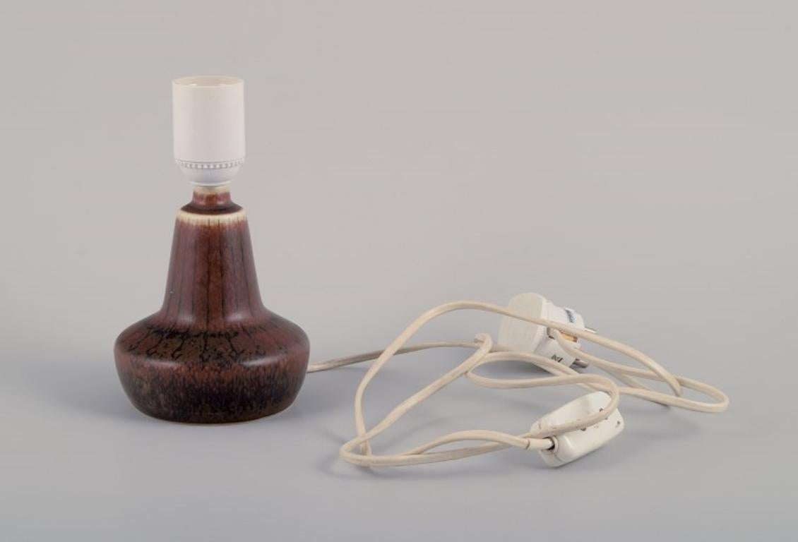 Swedish Gunnar Nylund for Rörstrand. Small ceramic table lamp. Glaze in brown tones. For Sale