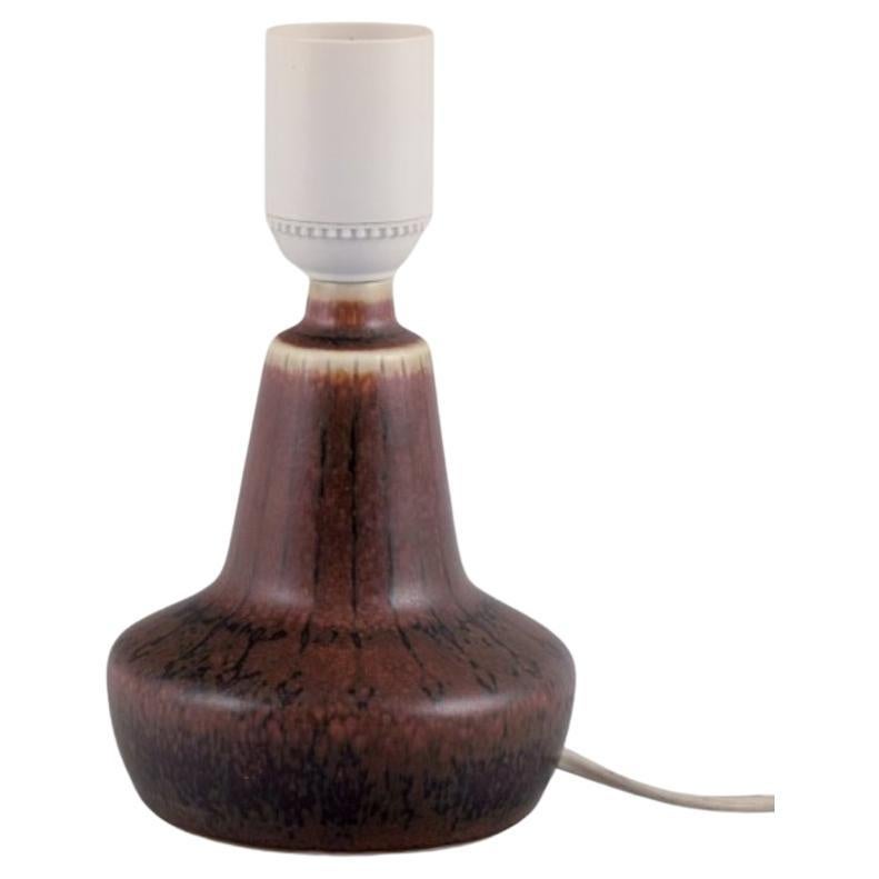 Gunnar Nylund for Rörstrand. Small ceramic table lamp. Glaze in brown tones. For Sale
