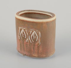 Gunnar Nylund for Rörstrand. Small ceramic vase with glaze in earthy tones.
