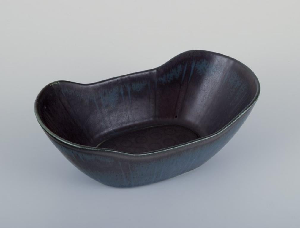 Glazed Gunnar Nylund for Rörstrand, Sweden. Ceramic bowl in blue tones. Mid-20th C.