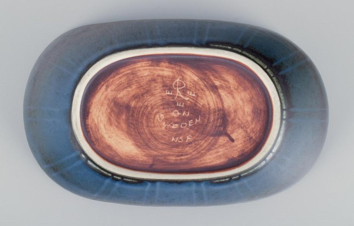 20th Century Gunnar Nylund for Rörstrand, Sweden. Ceramic bowl in blue tones. Mid-20th C.
