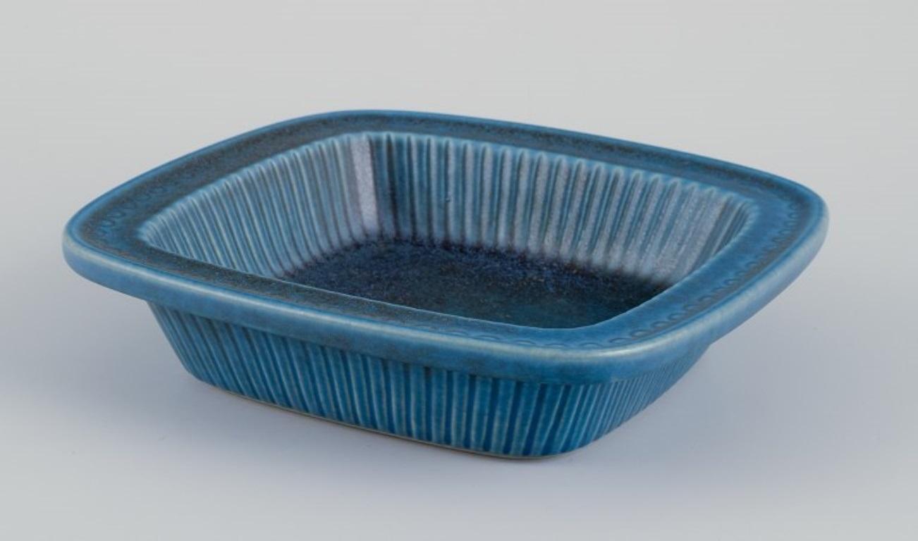 Gunnar Nylund (1904-1997) for Rörstrand, Sweden. 
Low bowl with blue-toned glaze from the 