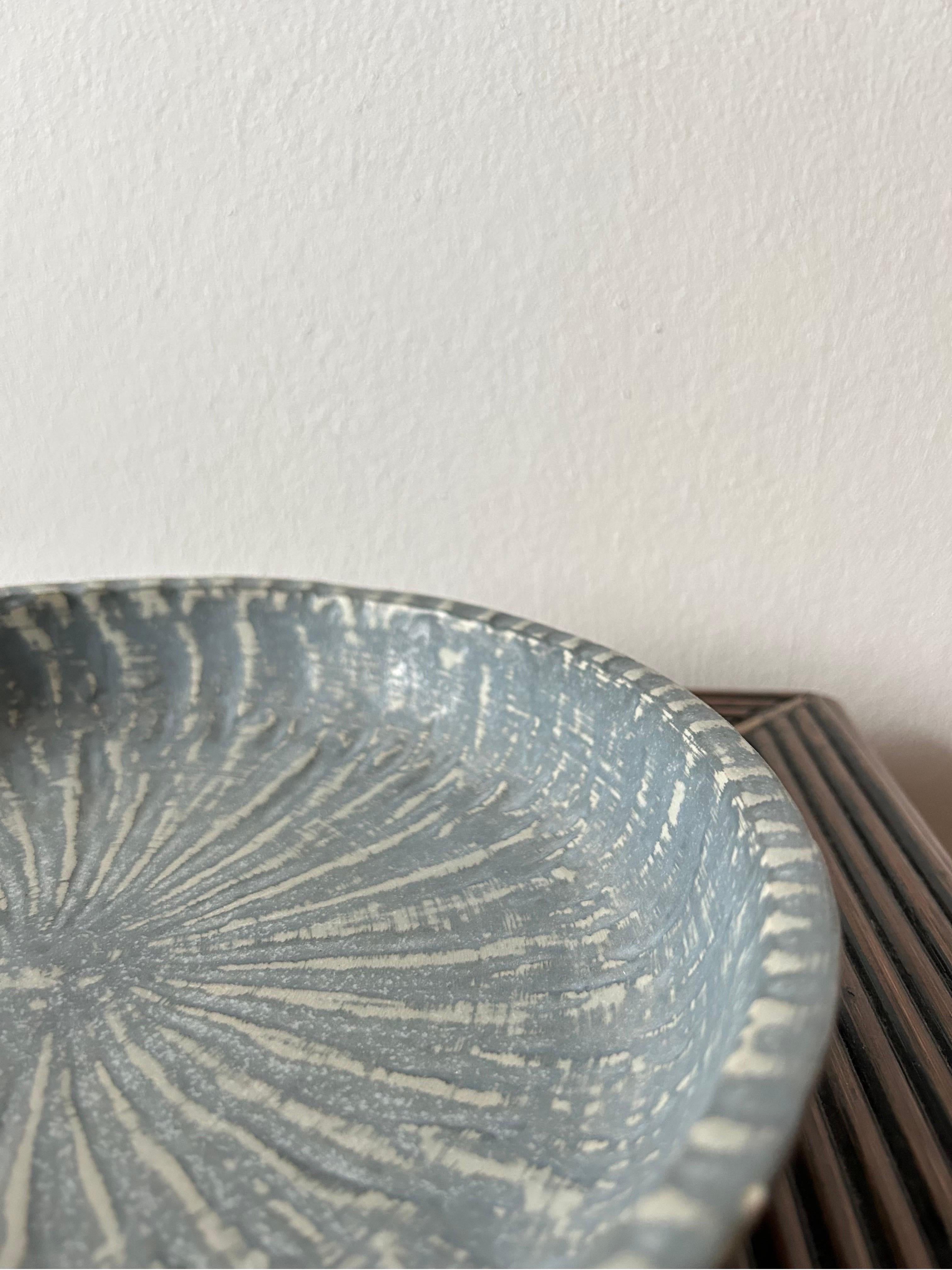 Highly decorative bowl by Swedish ceramic artist Gunnar Nylund from the Rubus series.

The bowl has a beautiful light blue glaze which adds great detail to the piece.


Use it for fruit or nuts or whatever else you could think of placing in