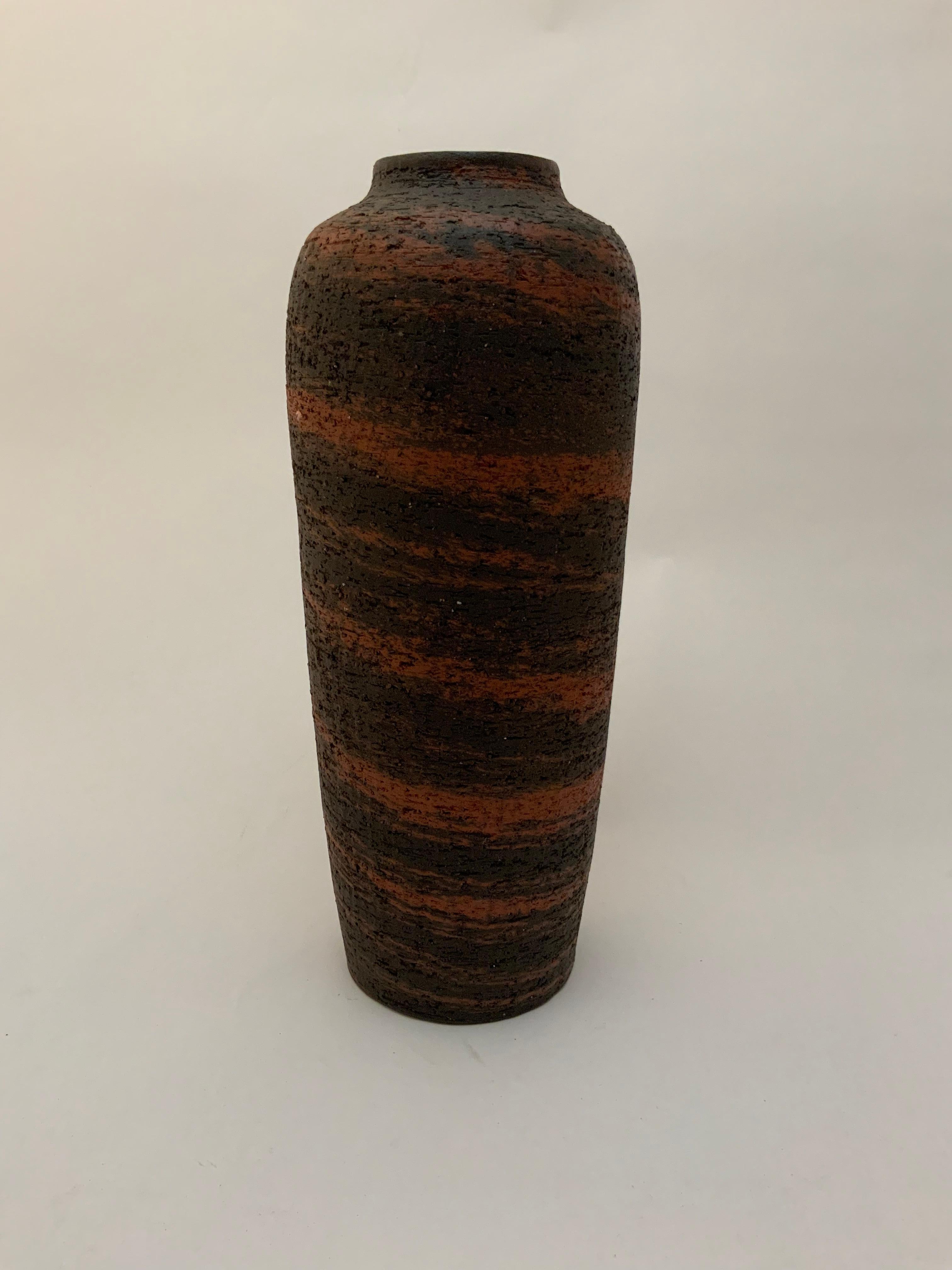 Tall pottery vase by Gunnar Nylund (1914-1997) for Nymolle, Denmark. Early, tall and beautiful stoneware matte glazed vase. Fully signed on the bottom. Excellent original condition.

Approximately measures 10” high x 4” diameter.