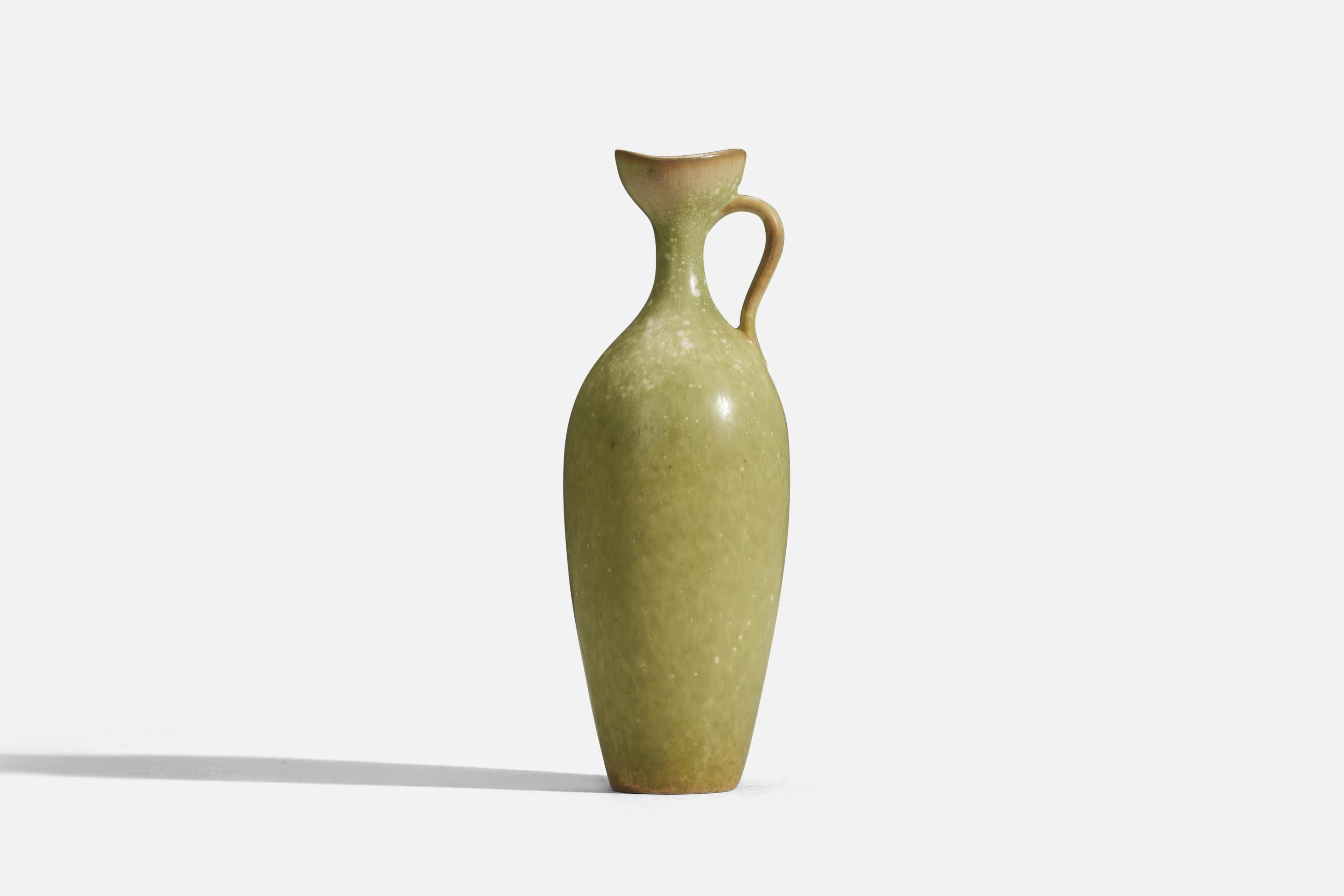 A green glazed stoneware pitcher designed by Gunnar Nylund and produced by Rörstrand, Sweden, 1950s.
