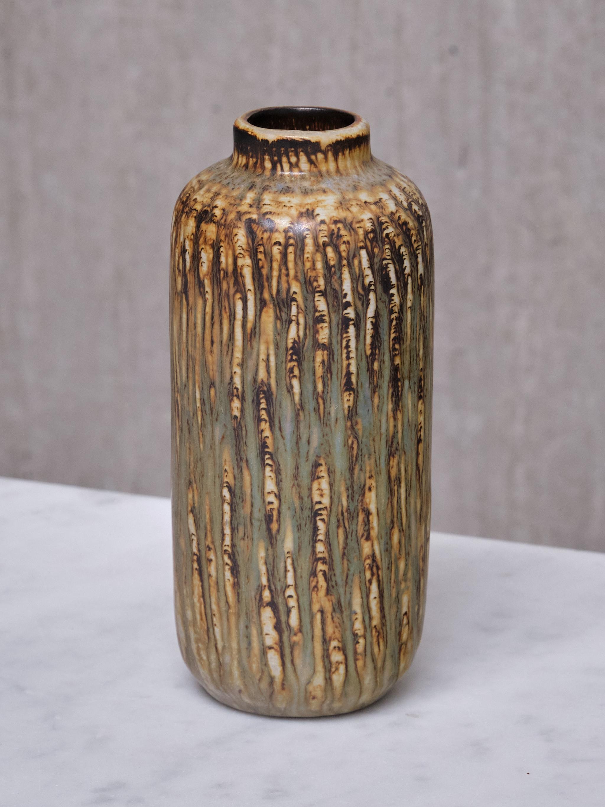 This stoneware vase was designed by Gunnar Nylund and produced in Sweden in the late 1960s. 
Nylund designed many classics for the Swedish ceramic factory Rörstrand. One of the most well-known series is Rubus from 1965, consisting of stoneware bowls