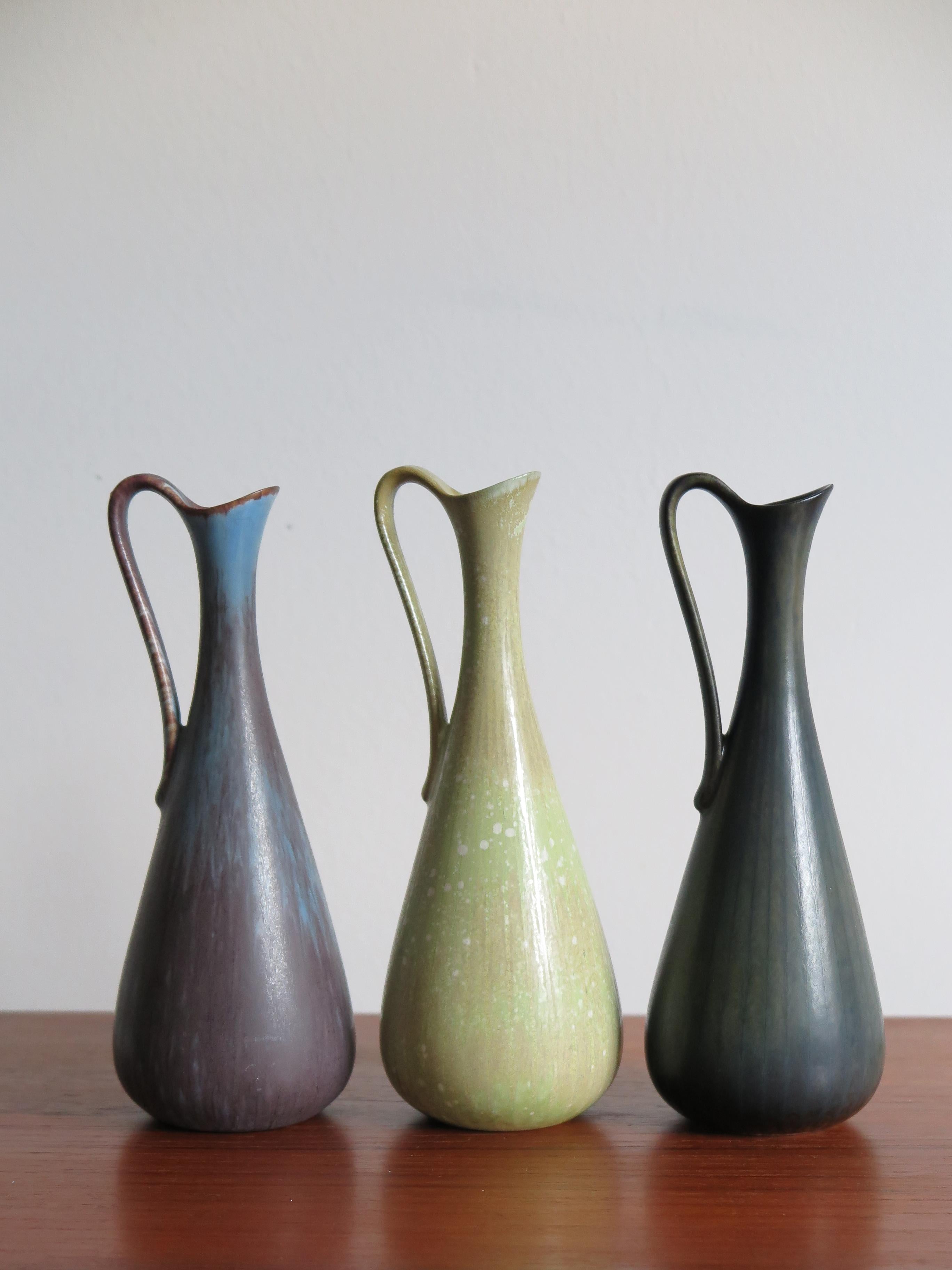Set of three Scandinavian rare stoneware vases in matt enamel designed by Gunnar Nylund for Rörstrand, made in Sweden, marked on the bottom.
Perfect condition.
 