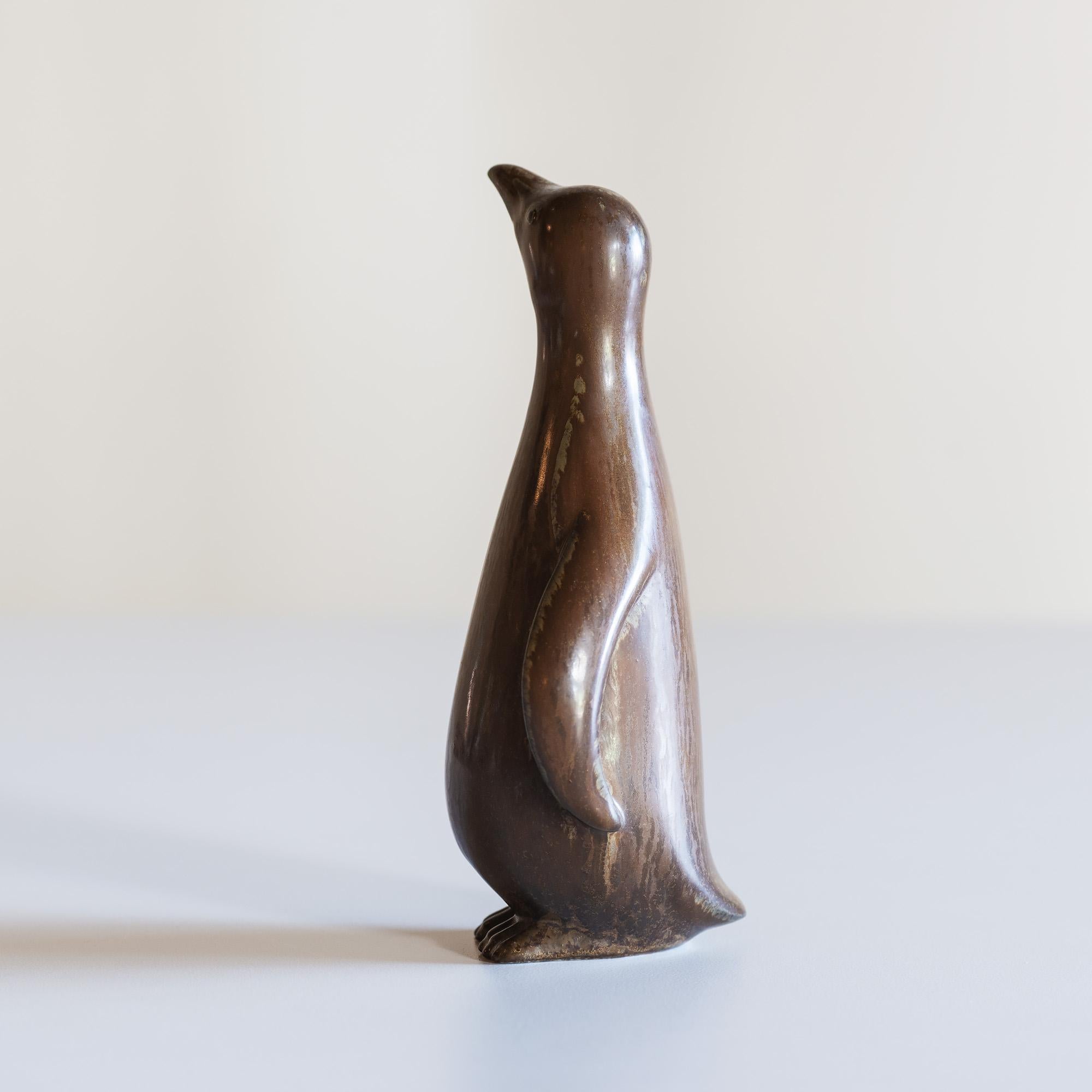Gunnar Nylund stoneware penguin in mottled brown for Rörstrand, Sweden.