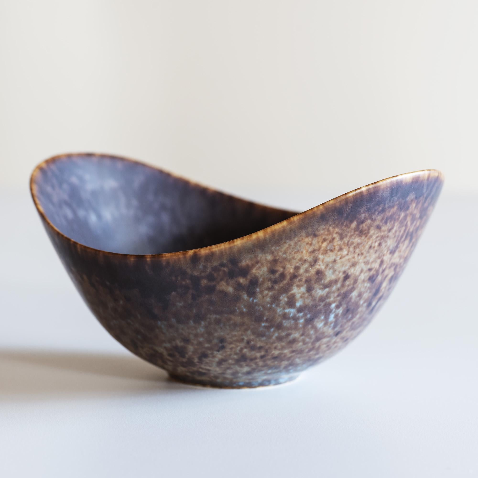 Single Gunnar Nylund stoneware vessel for Rörstrand, Sweden. Matte hares fur glaze in shades of brown with blue accents.
  