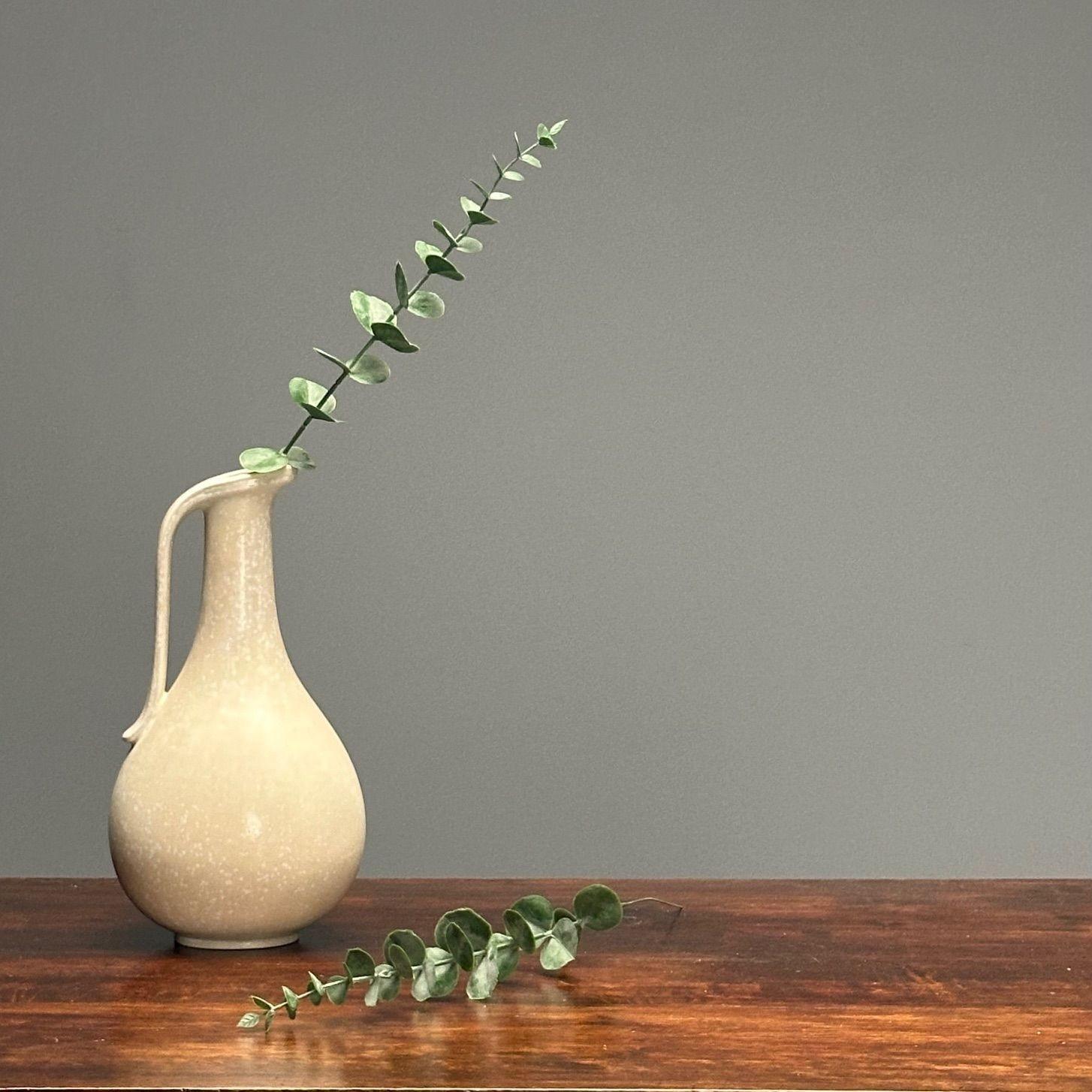 Gunnar Nylund, Swedish Mid-Century Modern, Ceramic Vase, Vessel, Jug, Eggshell Glaze, 1940s

Stoneware jug, vase, or vessell designed by Gunnar Nylund for Rorstrand in Sweden in the middle of the 20th century. This example features a nice neautral