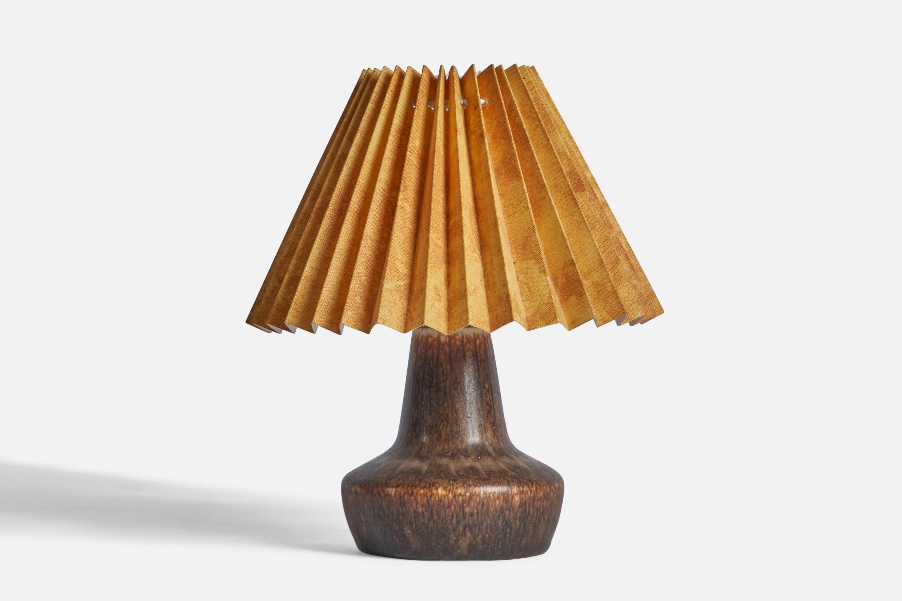 A brown-glazed stoneware and yellow paper table lamp, designed by Gunnar Nylund and produced by Rörstrand, Sweden, 1940s.

Overall Dimensions (inches): 9.5
