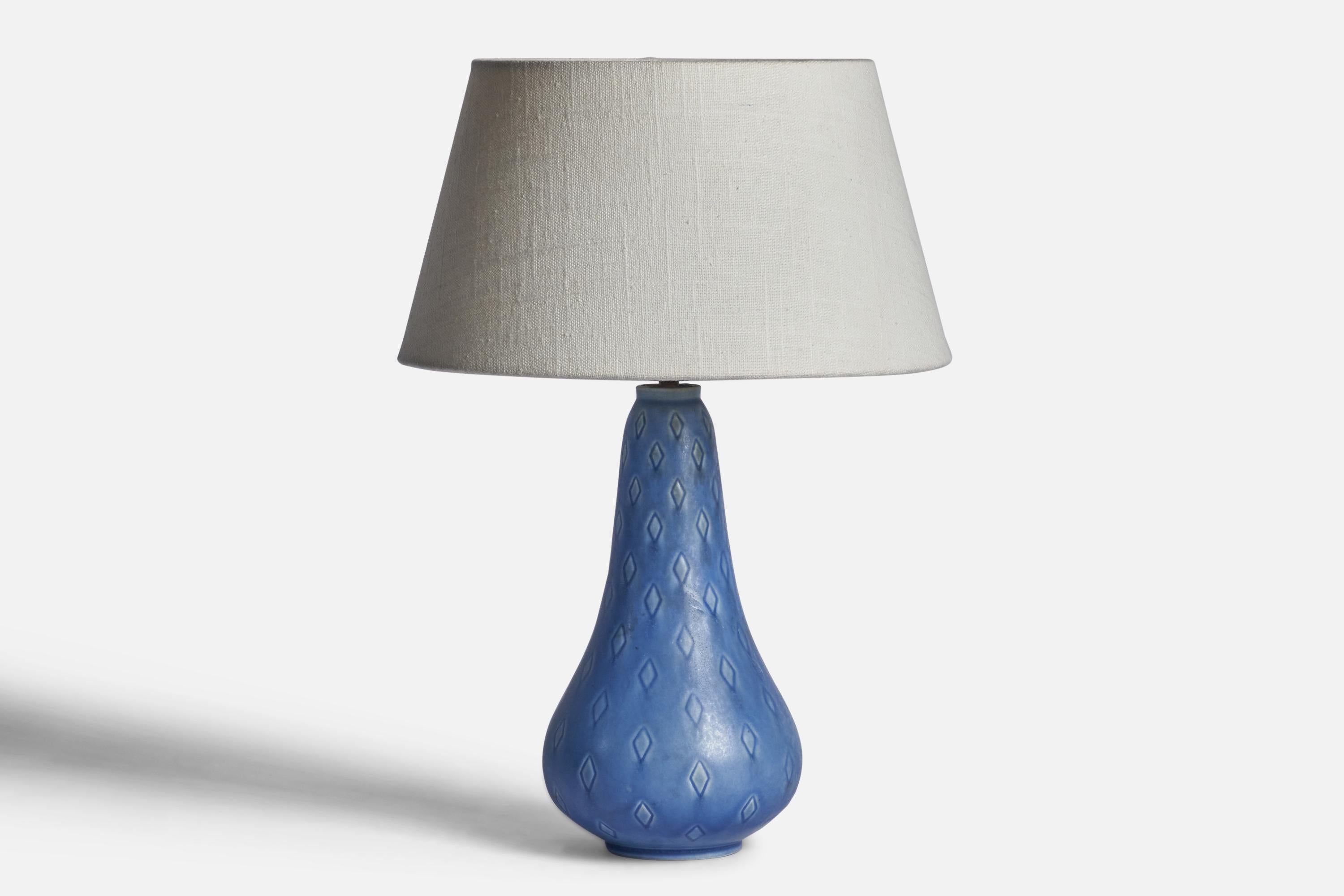 A blue-glazed stoneware table lamp designed and produced in Sweden, 1940s.

Dimensions of Lamp (inches): 11.65” H x 4.65” Diameter
Dimensions of Shade (inches): 7” Top Diameter x 10” Bottom Diameter x 5.5” H 
Dimensions of Lamp with Shade (inches):
