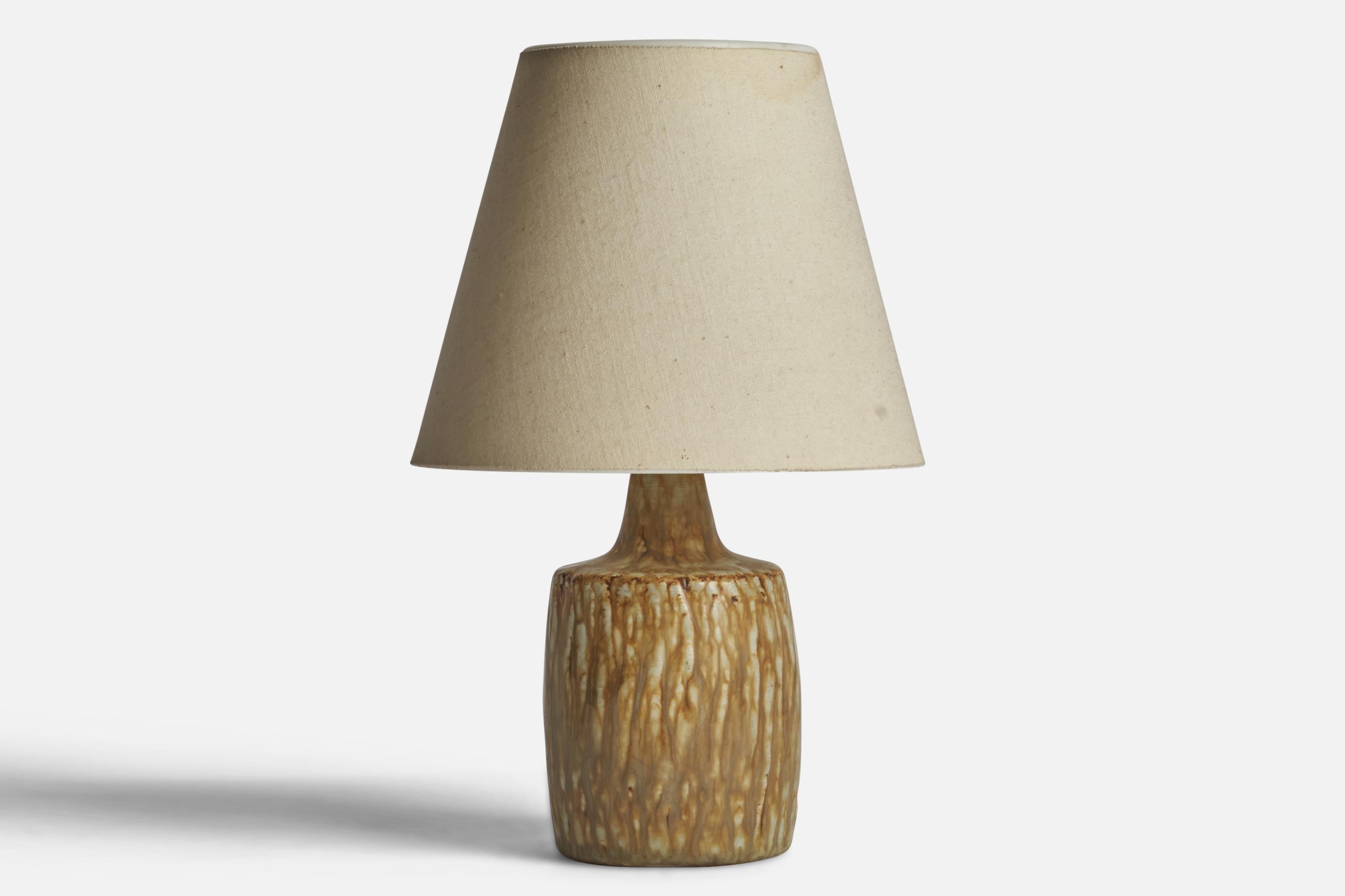 A grey-beige-glazed stoneware table lamp designed by Gunnar Nylund and produced by Rörstrand, Sweden, 1940s.

Dimensions of Lamp (inches): 7.5” H x 3.25” Diameter
Dimensions of Shade (inches): 3.5” Top Diameter x 6.5” Bottom Diameter x 5.5”