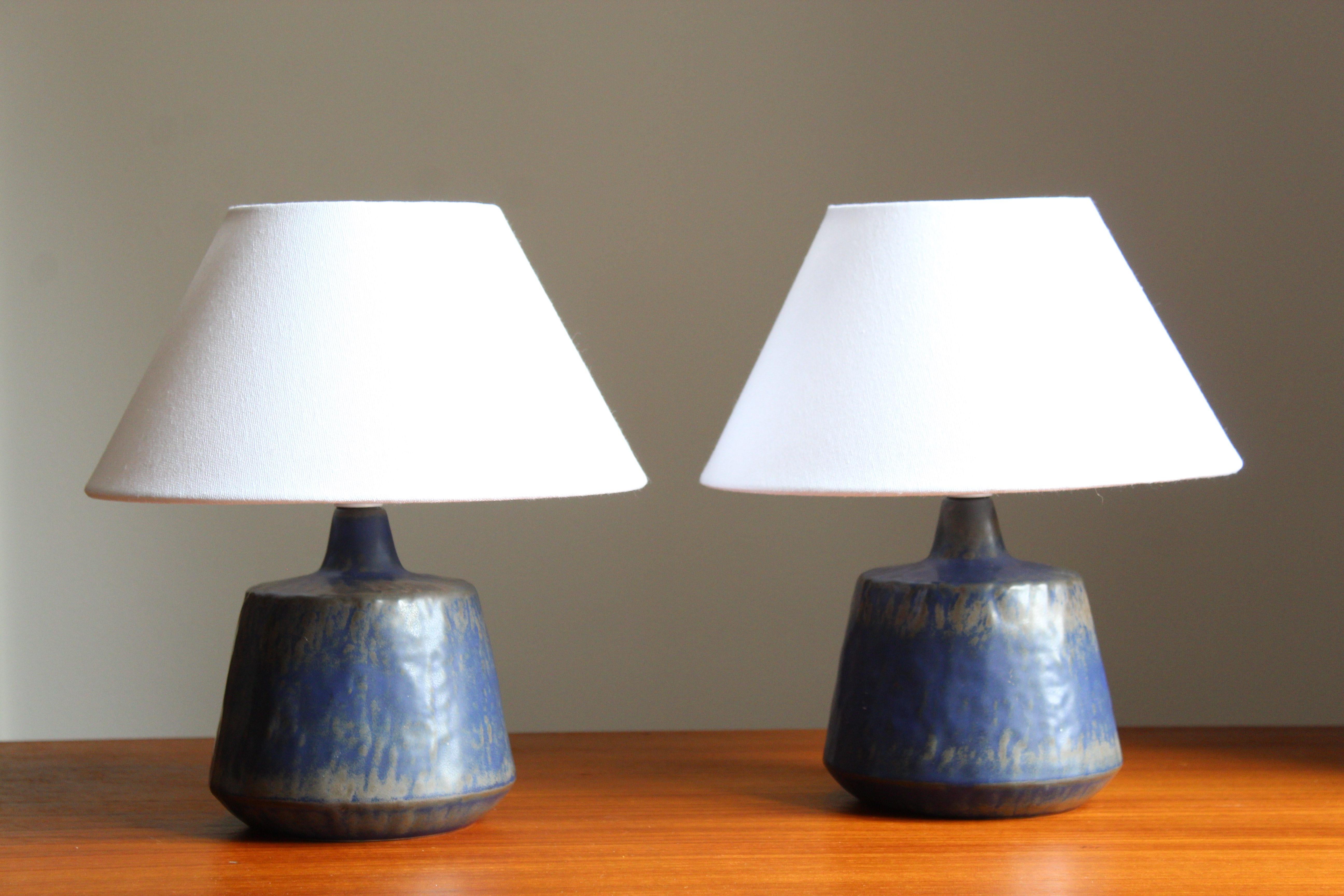 A pair table lamps produced by Rörstrand, Sweden, 1950s. Designed by Gunnar Nylund, (Swedish, 1914-1997). Signed. Sold without lampshades.

Nylund served as artistic director at Rörstrand, where he worked, 1931-1955. Prior to his work at Rörstrand