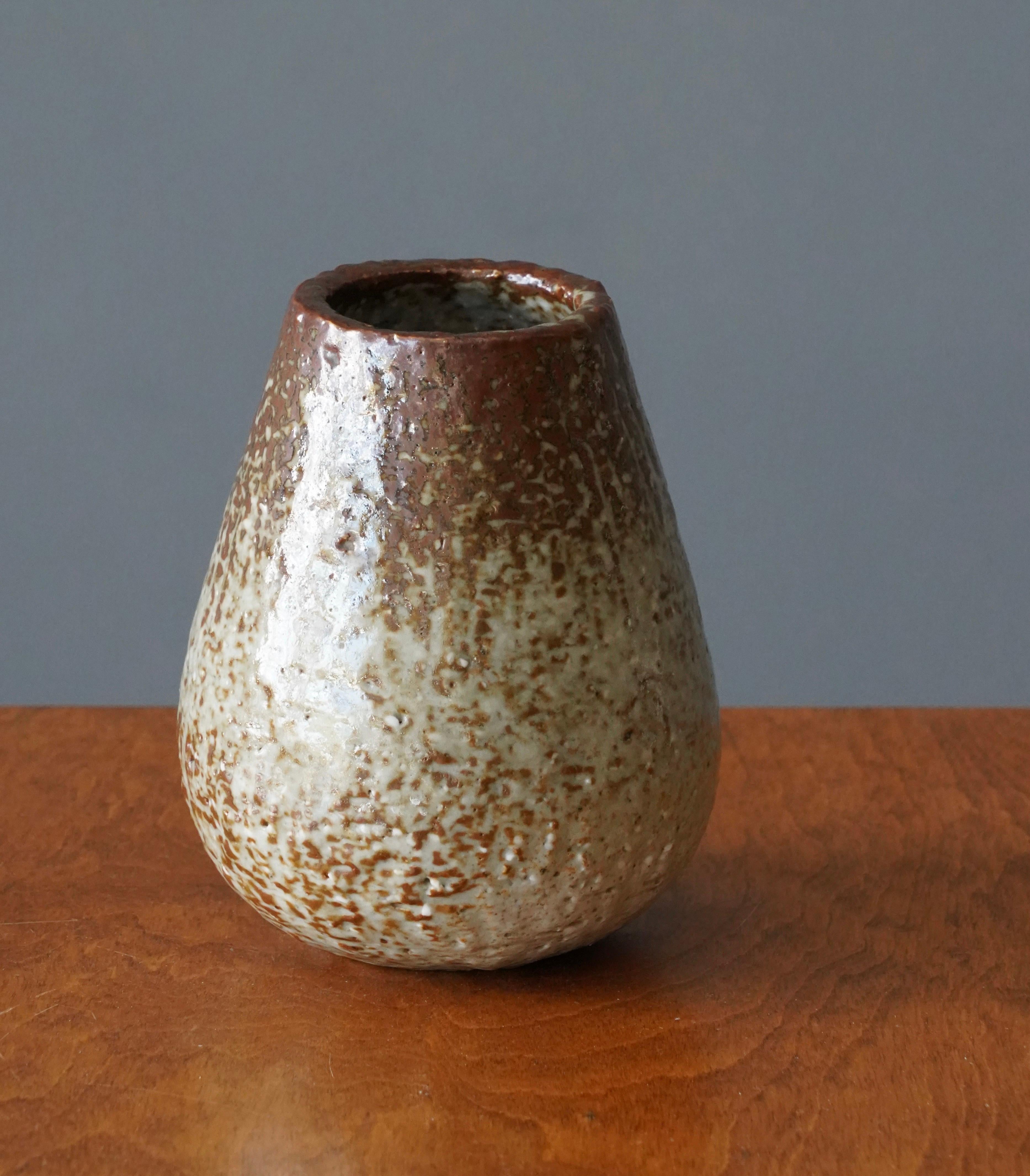 A vase produced by Rörstrand, Sweden, 1950s. Designed by Gunnar Nylund, (Swedish, 1914-1997). Stamped. 

Nylund served as artistic director at Rörstrand, where he worked, 1931-1955. Prior to his work at Rörstrand he was a well-established ceramic