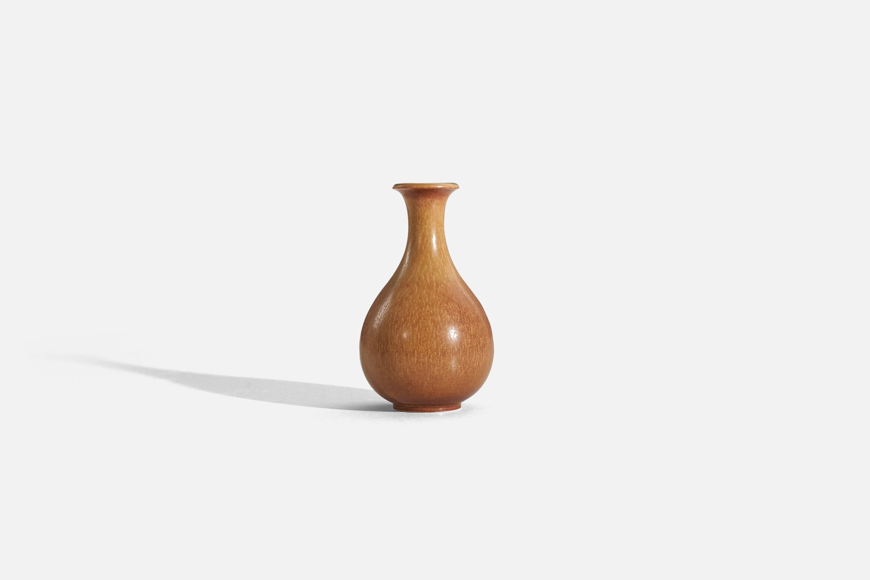 An orange-brown, glazed stoneware vase designed by Gunnar Nylund and produced by Rörstrand, Sweden, 1940s. 

