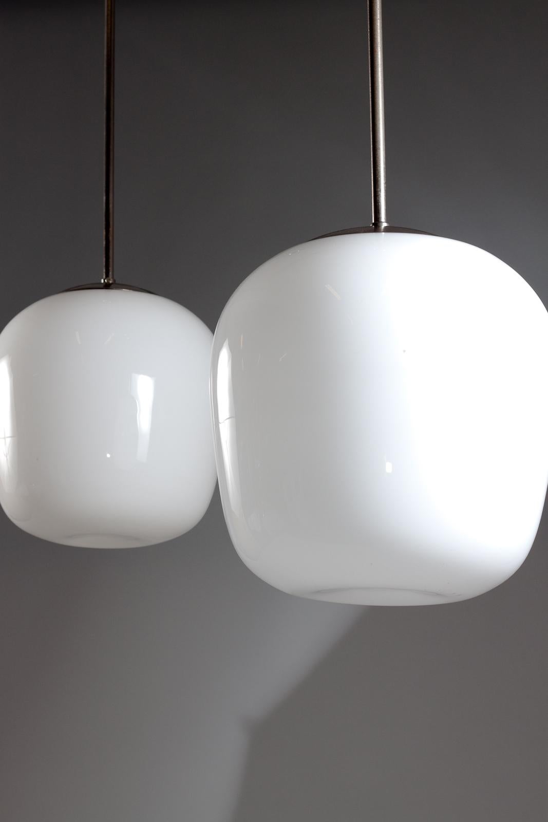 Finnish Gunnel Nyman, pair of 1940's opaline glass pendant lamps for Idman Oy For Sale