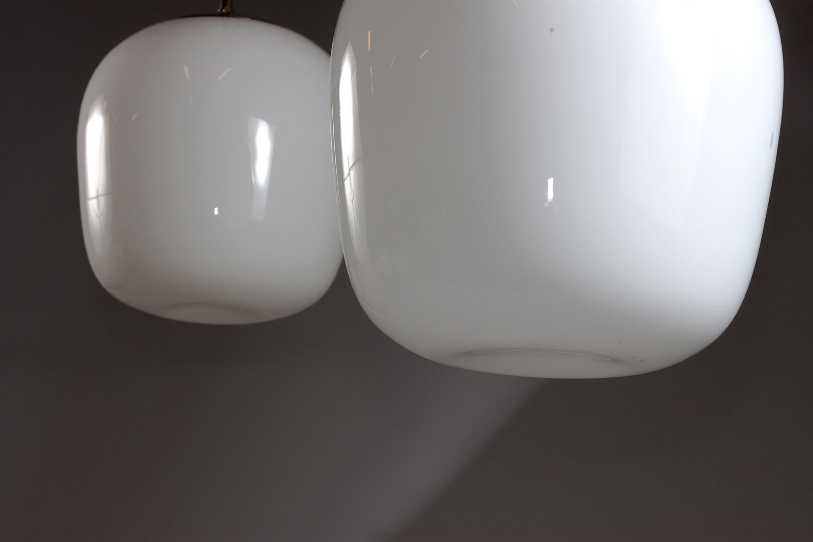 20th Century Gunnel Nyman, pair of 1940's opaline glass pendant lamps for Idman Oy For Sale