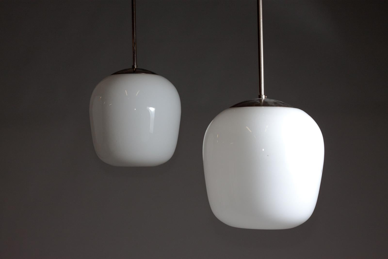 Opaline Glass Gunnel Nyman, pair of 1940's opaline glass pendant lamps for Idman Oy For Sale