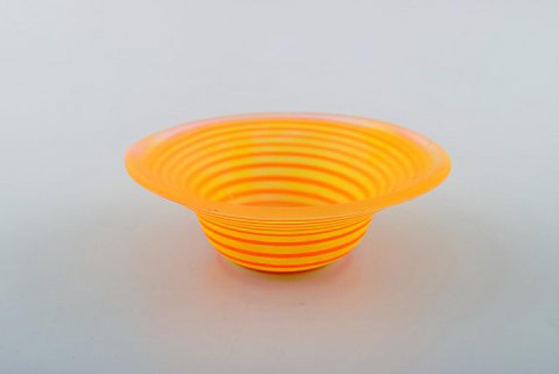 Gunnel Sahlin for Kosta Boda Atellier, Sweden. Yellow bowl in art glass decorated with orange spiral. 1994.
In perfect condition.
Measures: 10.5 x 3.5 cm.
Signed and dated.