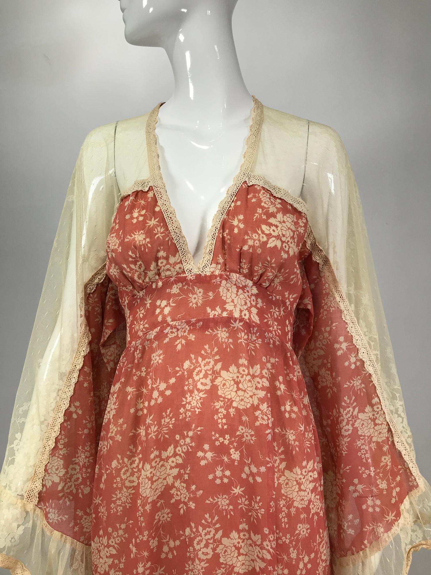 GunneSax by Jessica made in San Francisco, tulle shoulder angel sleeve calico prairie dress 1969. Early rare open tulle shoulder calico prairie dress with huge angel sleeves. The fabric is a pale coral with cream sprigged flowers, v neck empire