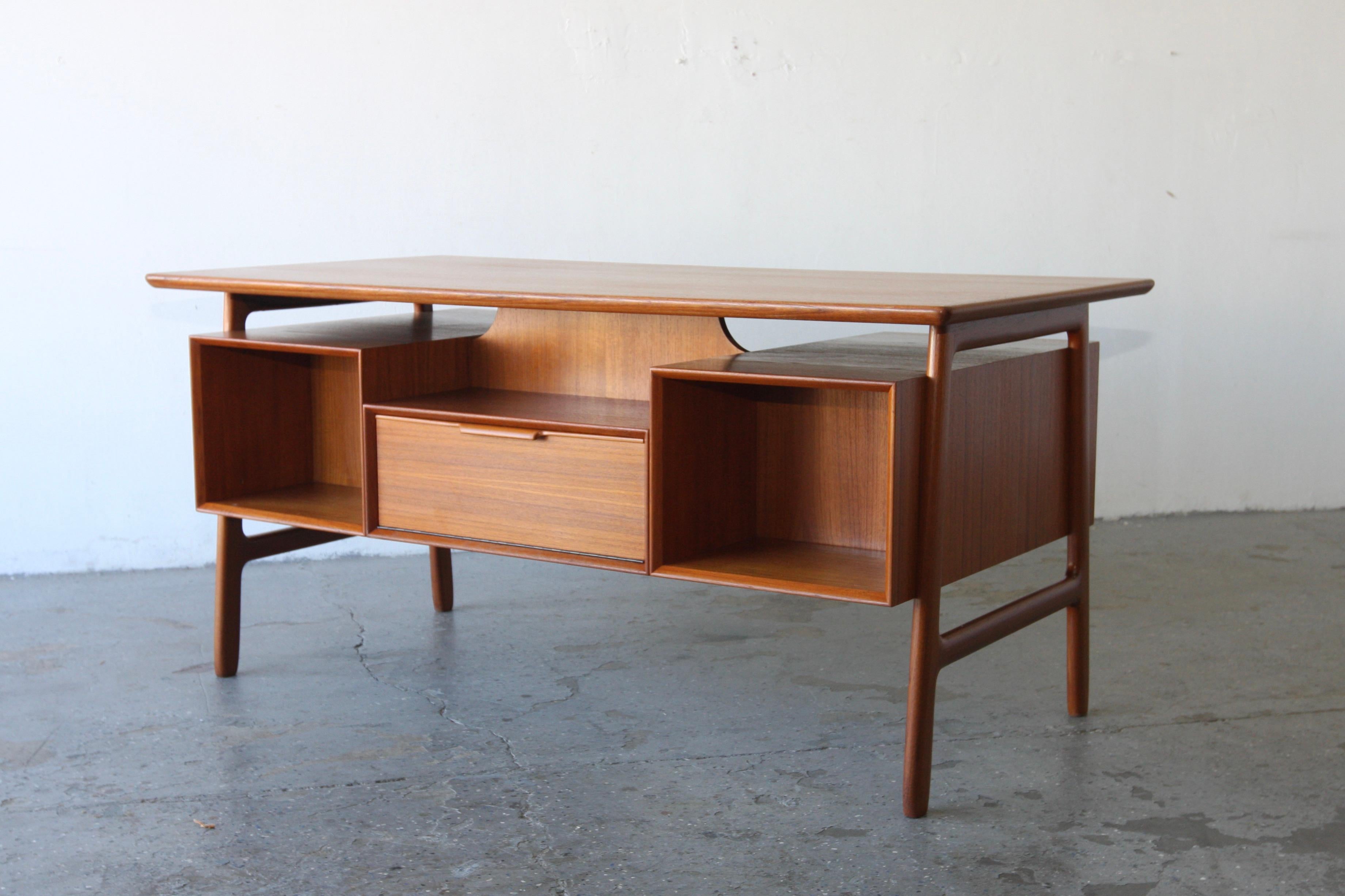Gunni Omann Model #75 Desk for Omann Jun Mobelfabrik

Beautiful Danish floating top teak desk by Gunni Omann design Model #75 for Omann Jun, Denmark.
It is exquisitely made desk using high quality teak. The construction and materials are top notch
