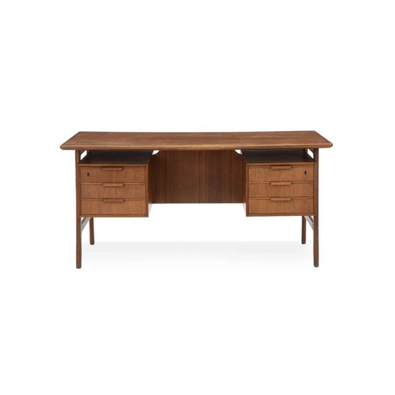 Gunni Omann teak desk.

'Model 75' desk.

Dimension: H 73 x W 154 x D 81 cm.