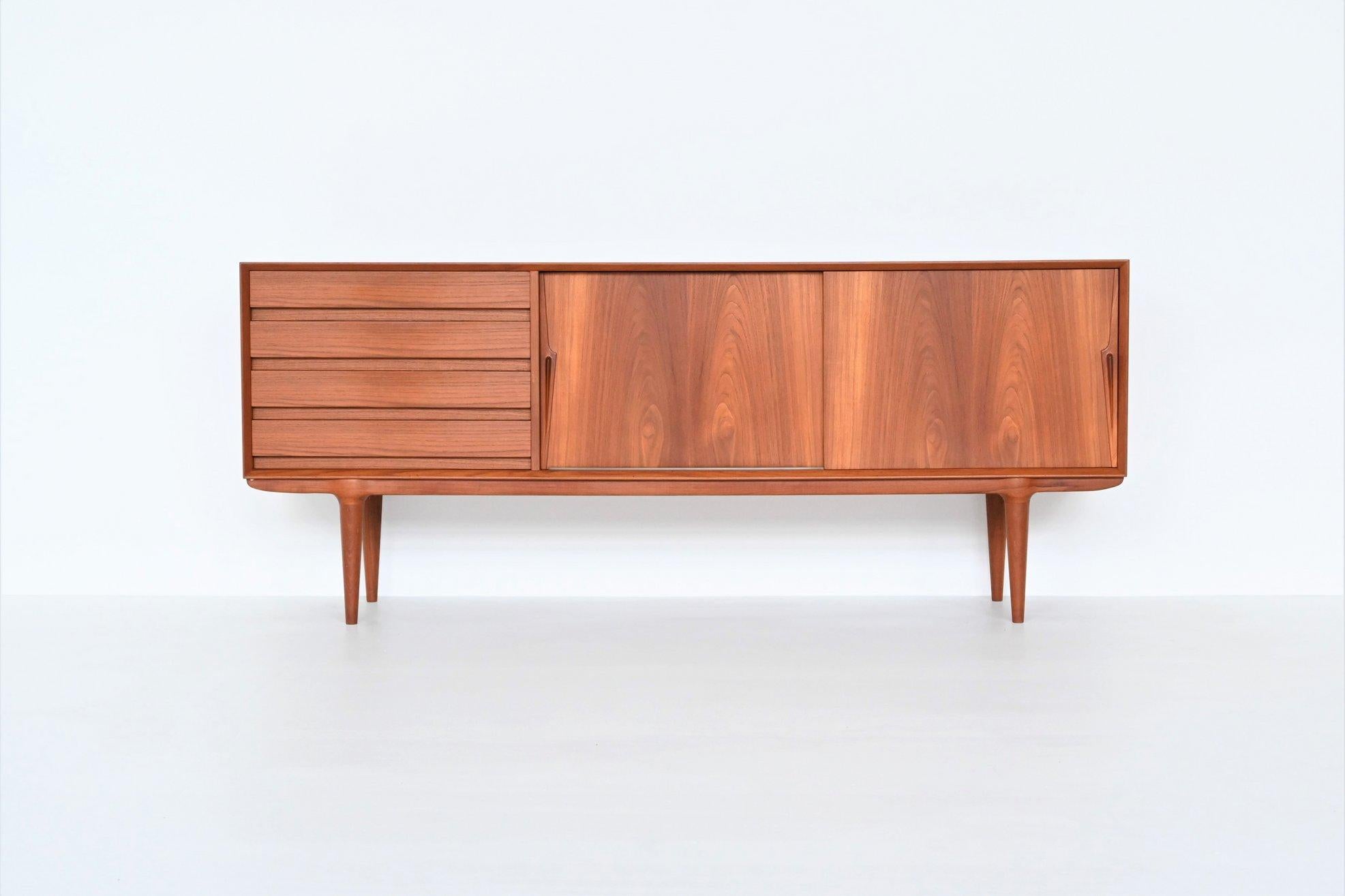 Beautiful sideboard model 18 designed by Gunni Omann and manufactured by Omann Jun, Denmark 1960. Superb example of Danish refined furniture. This teak wood credenza features wonderful details and great craftsmanship which Omann Jun and Gunni Omann