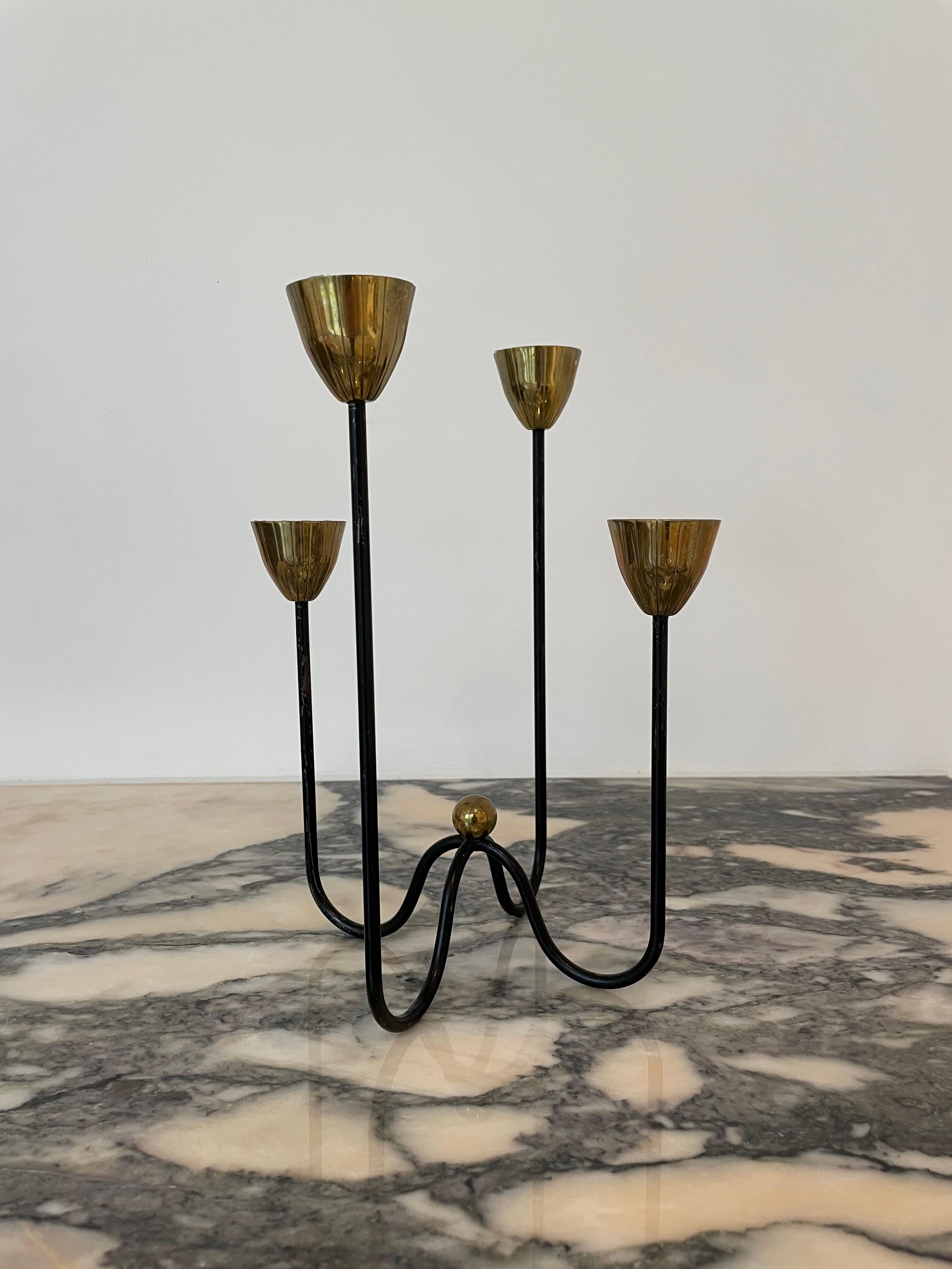 Made from Brass in Sweden in the 1950s. These candlesticks not only serve as functional candle holders but also make an elegant and decorative statement in any room or table setting. The Gunnar Ander Candlesticks reflect the timeless design and
