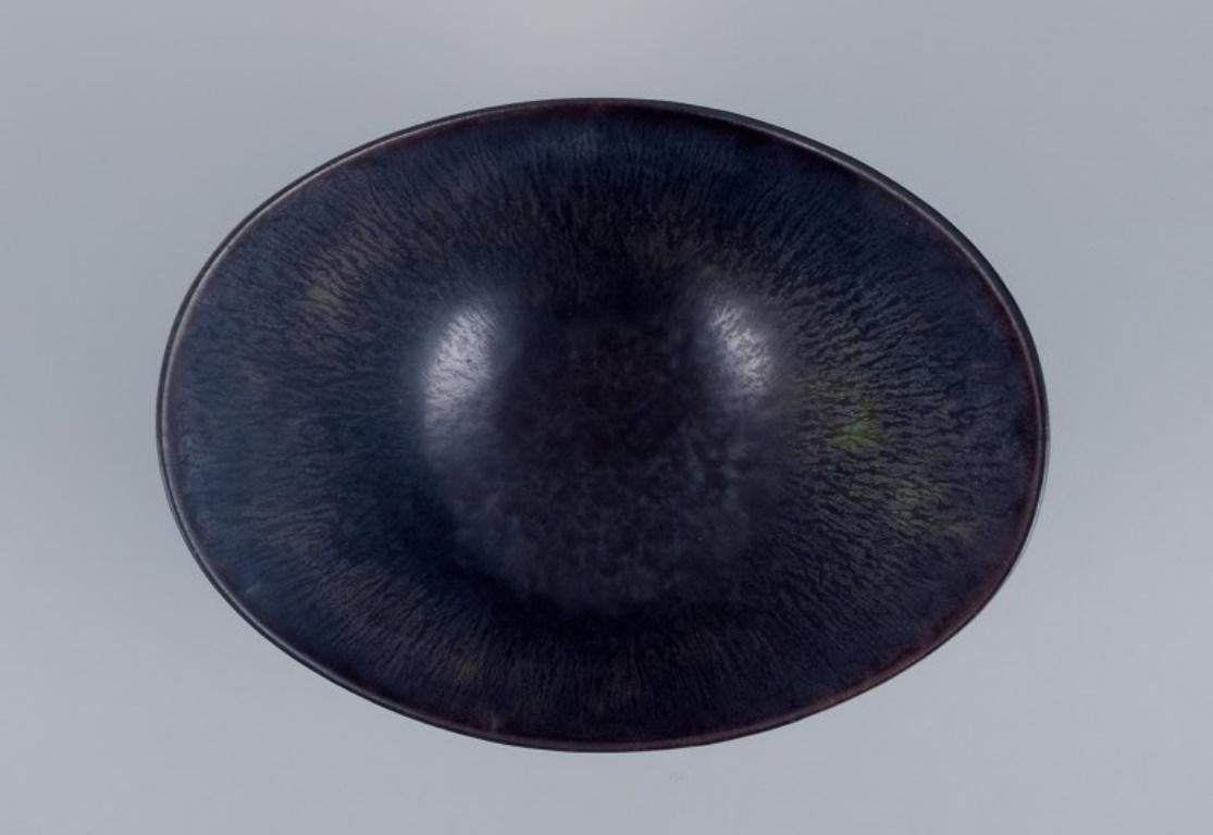 Glazed Gunnnar Nylund for Rörstrand, ceramic bowl with blue-violet glaze. Mid-20th C. For Sale