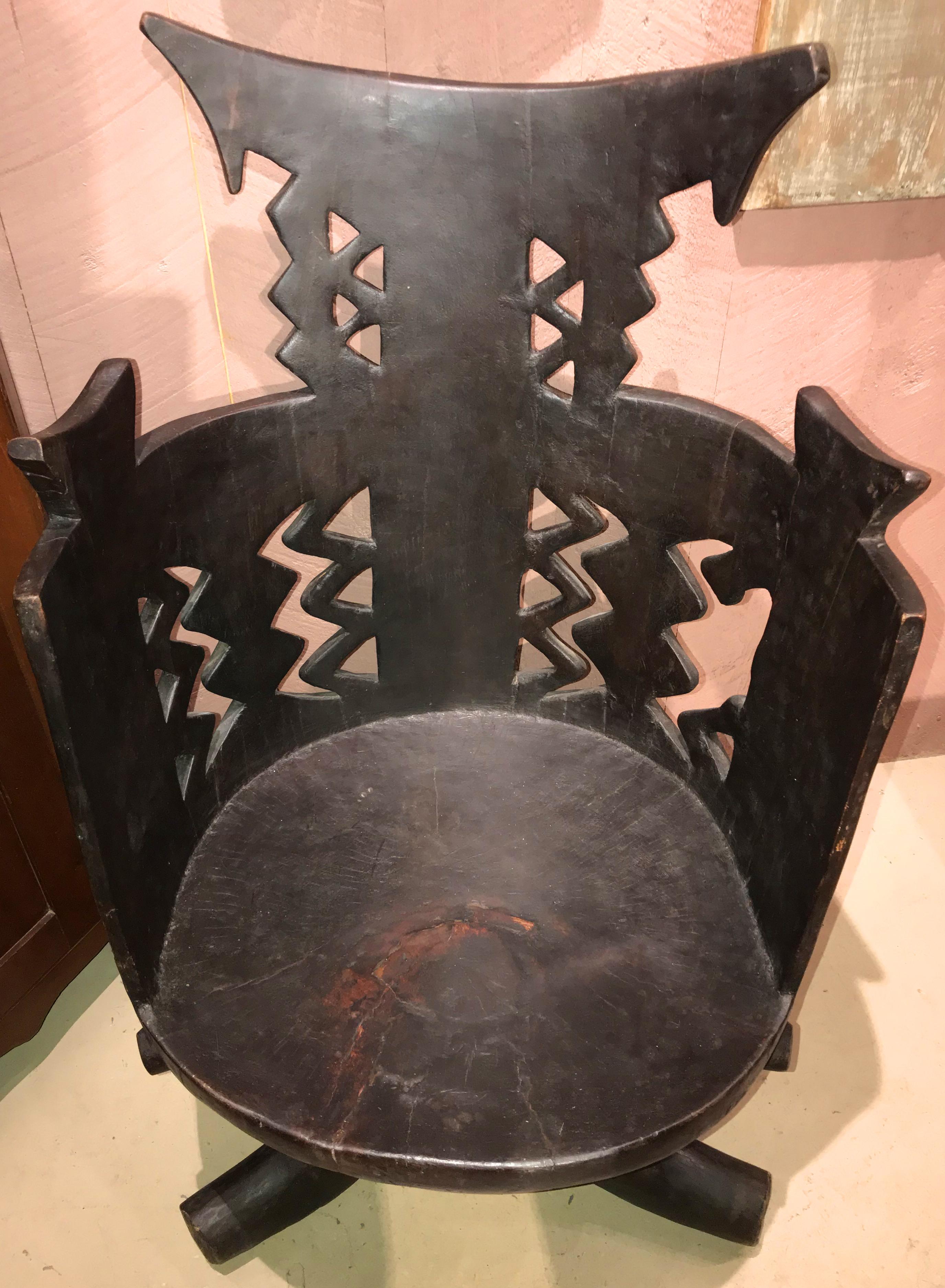 A wonderful hand-carved Jimma chair with tripod legs from a single piece of dense wanza wood, probably made by the Gurage people of Southwest Ethiopia in Africa. Probably dates to the 19th or early 20th century in very good overall condition, with