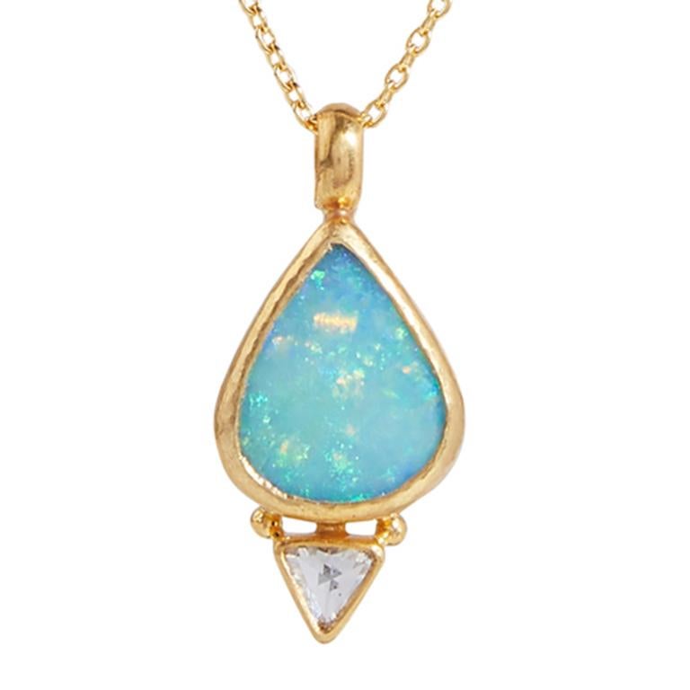GURHAN one-of-a-kind pendant necklace set in 24 Karat hammered yellow gold featuring a 13x11mm pear shaped cabochon Australian Opal, 3.25cts., and a white rosecut diamond, 0.20cts. 16-18