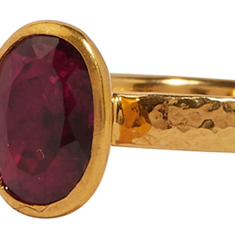 GURHAN one-of-a-kind ring set in 24 Karat hammered yellow gold featuring a 12x6mm oval faceted Pink Tourmaline, 2.25cts. Bezel, vertical setting with 2.80mm 22 Karat hammered yellow gold shank, size 6.5. 