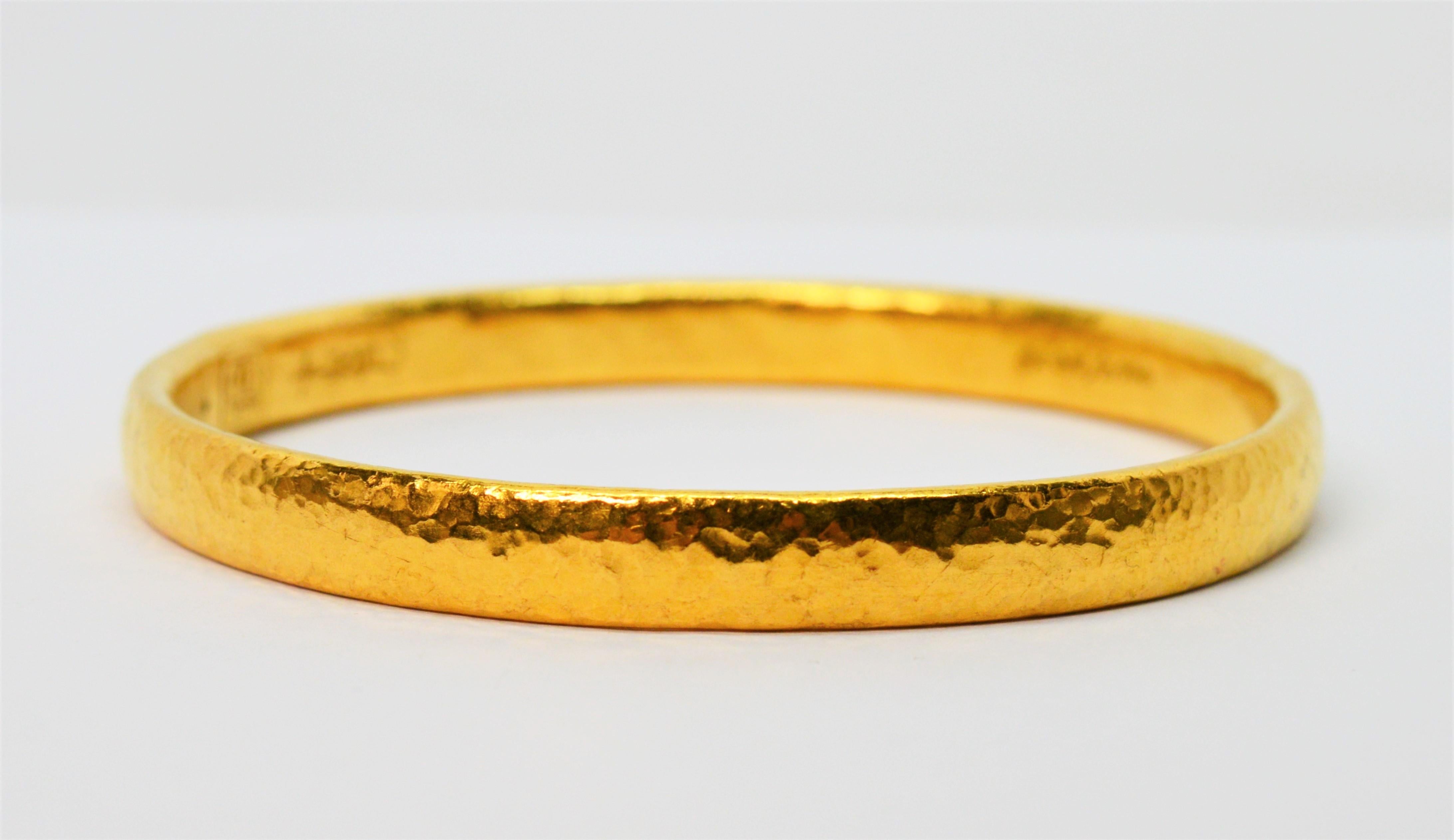 Enjoy the simplicity of this exquisite twenty four karat 24K hammered yellow gold bangle bracelet by internationally known Gurhan Atelier. 
New York based with master artisans in Istanbul to create this hand hammered lost wax cast notable piece. The
