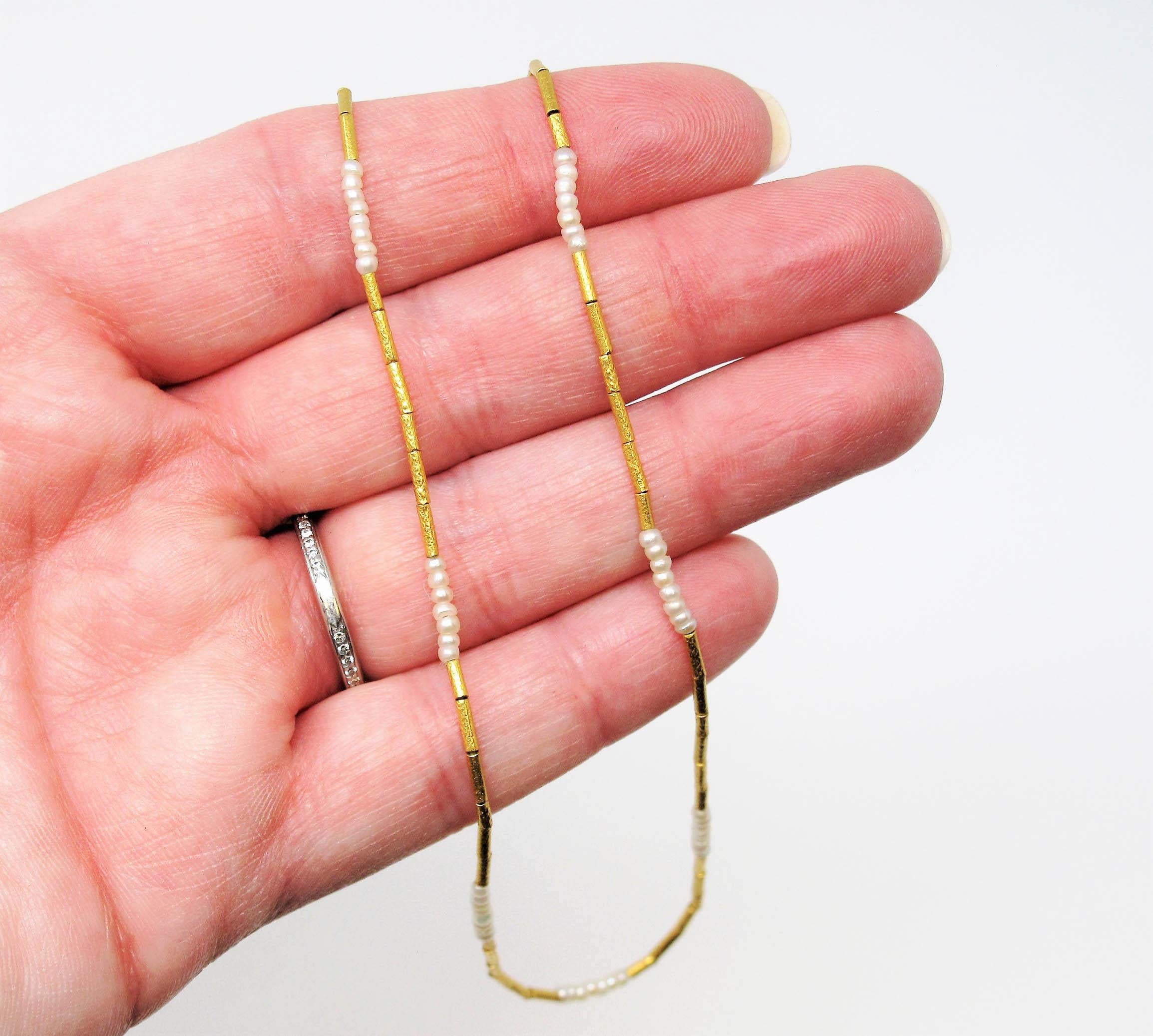 This beautiful single strand pearl station necklace by acclaimed jeweler Gurhan is the essence of minimalist elegance. The delicate features and incredible attention to detail make for a simple, yet stunning highly feminine piece. Either worn on its