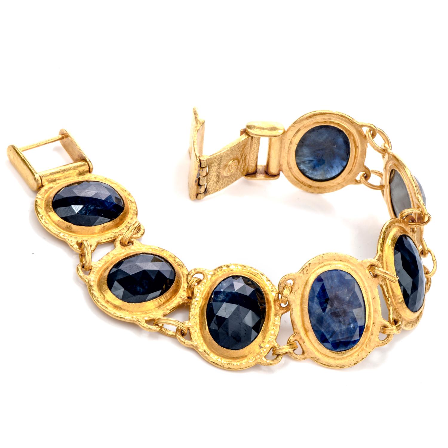 This beautiful hand embellished link bracelet was

crafted in pure 24K gold.

Featuring 7 large oval shaped in intense Blue Sapphires

each mesauring appx. 11.5 x 16.3mm e and hinged in between by 2 rings.

Sapphire weight is appx. 55.00